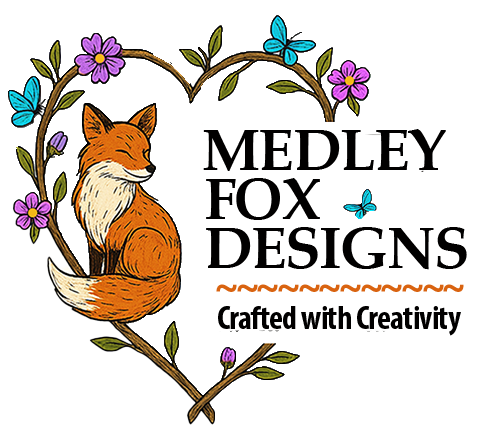 Medley Fox Designs logo featuring a peaceful orange fox inside a heart-shaped floral frame with the tagline “Crafted with Creativity” and a wavy orange divider.